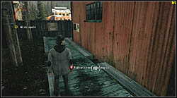 Another sheet lies on the ground, next to a red building at the coal mine - Alan Wake: Episode 3 Ransom - list of manuscript pages - Manuscript - Alan Wake Game Guide & Walkthrough