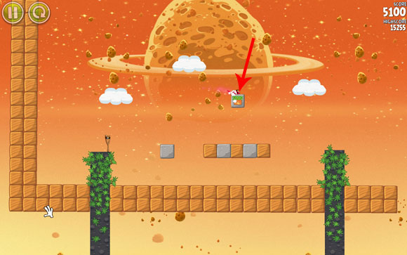 The bird should hit the indicated block and eliminate the pig that jumps from it - Level E-2 - Eggsteroids - Angry Birds Space - Game Guide and Walkthrough