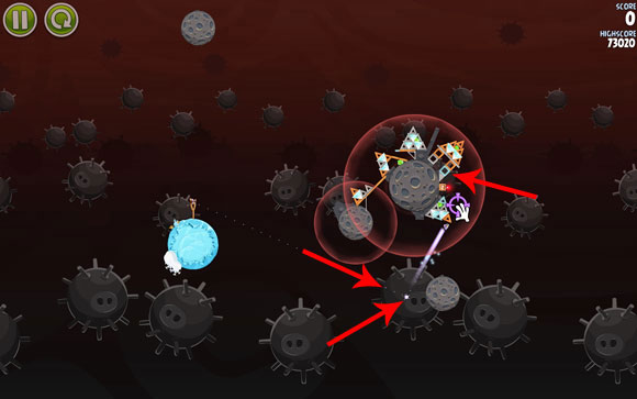 Launch the first bird towards the smaller planet - the flight path passing right next to the gravity field - Level 3-26 - Danger Zone - Angry Birds Space - Game Guide and Walkthrough