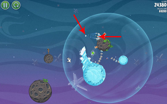 Aim the second bird at locked balls and the middle planet - Level 2-13 - Cold Cuts - Angry Birds Space - Game Guide and Walkthrough
