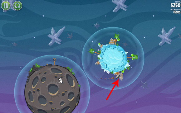 Adjust the flight path to go through the area where the gravity fields are the closest to each other - Level 2-8 - Cold Cuts - Angry Birds Space - Game Guide and Walkthrough