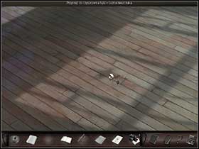 The symbol is reflected on the floor of the room, so Nicole takes a closer look at the spot on the floor (zoom in) - Paris, France, April 15-17, 2008 - Ballet room - April 15-17, 2008 - Art of Murder: Hunt For The Puppeteer - Game Guide and Walkthrough