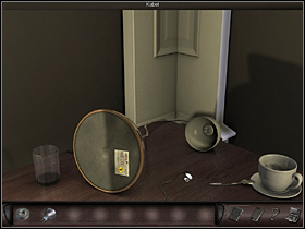 Back in the room she approaches the desk (close-up) to create a makeshift connection - Paris, France, April 15-17, 2008 - Hotel - April 15-17, 2008 - Art of Murder: Hunt For The Puppeteer - Game Guide and Walkthrough