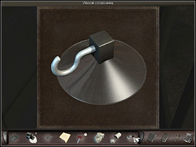 Theres a phone booth nearby and she looks inside, just in case (zoom in) she finds there a large stone, holding a page in the phone book, a film case and a small stone (on the phone) - Marseilles, France, April 19, 2008 - Gate; wall; phone booth; harbor - April 19, 2008 - Art of Murder: Hunt For The Puppeteer - Game Guide and Walkthrough