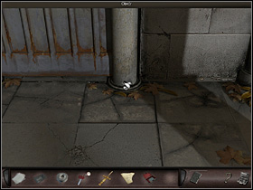 She examines the pillars on both sides of the door along with the holes at its bases - Paris, France, April 23, 2008 - Montmartre Cemetery - part 1 - April 23, 2008 - Art of Murder: Hunt For The Puppeteer - Game Guide and Walkthrough