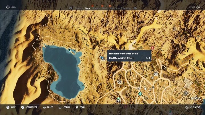 The entrance is located at the bottom of a rock - Tombs in Siwa Walkthrough - Tombs - Assassins Creed Origins Guide