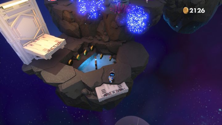 Use the circular platform to jump over to the next rock - Astros Playroom: Deep Dataspace - walkthrough - SSD Speedway - Astros Playroom Guide