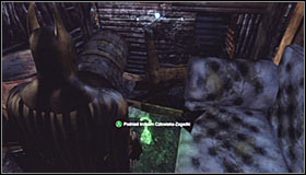 Turn on the Detective Mode to note that the wooden obstacle can be destroyed using the Explosive Gel #1 - Batman trophies (15-24) | Park Row - Park Row - Batman: Arkham City Game Guide