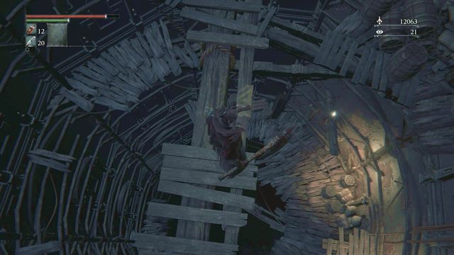 There is a spiral way leading down. Carefully jump from one platform to another. - Healing Church Workshop | Walkthrough - Walkthrough - Bloodborne Game Guide & Walkthrough