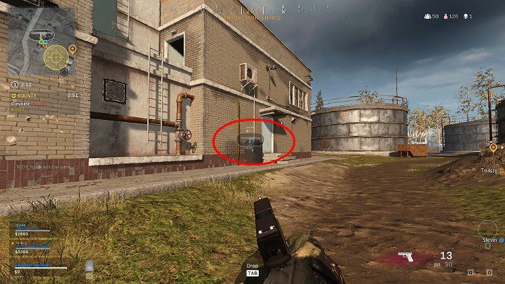 The image above shows one of the team members tagging a rifle in a building across the street - Warzone: Communication - Basics - Warzone Guide