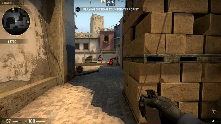 While crossing the center, you can aim at the point shown in the above screenshot, remove the pin and use LMB to throw the grenade while running - Mirage | Tournament maps in CS GO - Tournament Maps in Counter Strike: Global Offensive - CS GO Game Guide