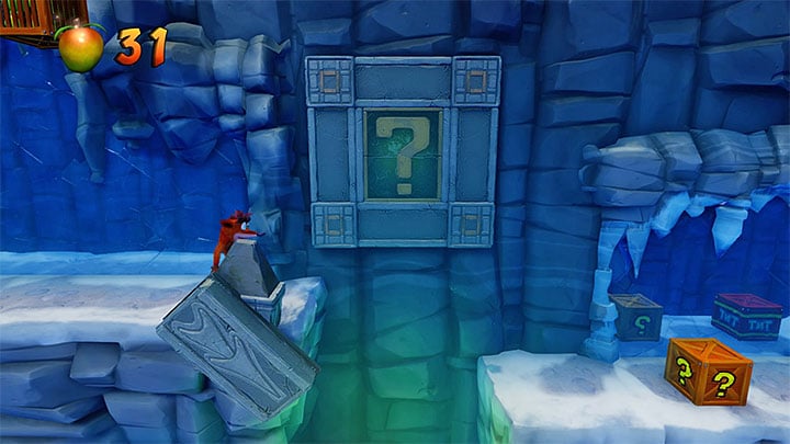 Run past the caving bridge and destroy the four chests arranged in a pyramid-like fashion - Crash Bandicoot N. Sane Trilogy: Cold Hard Crash - Crash Bandicoot N. Sane Trilogy: Crash Bandicoot 2 - Alpine Warp Room - Crash Bandicoot N. Sane Trilogy Game Guide