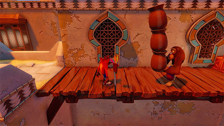 Take several jumps to reach the rooftop of the first building - Crash Bandicoot N. Sane Trilogy: Hang Em High - Crash Bandicoot N. Sane Trilogy: Crash Bandicoot 3 - Arabic location - Crash Bandicoot N. Sane Trilogy Game Guide
