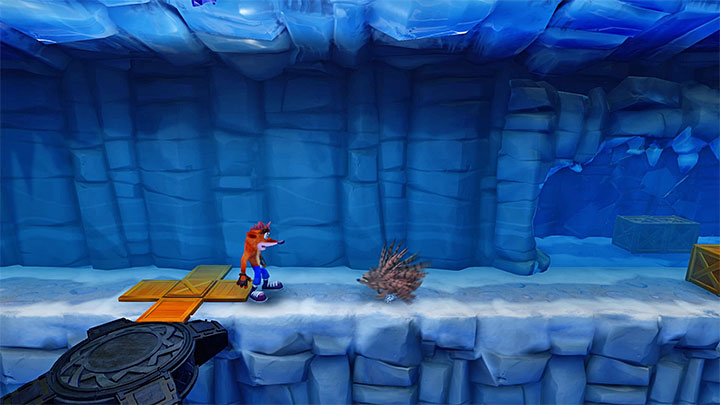 Right after the beginning of the stage, start sliding over ice and, at the right moment, take a jump to avoid the chasm - Crash Bandicoot N. Sane Trilogy: Snow Biz - Crash Bandicoot N. Sane Trilogy: Crash Bandicoot 2 - Ice Warp Room - Crash Bandicoot N. Sane Trilogy Game Guide
