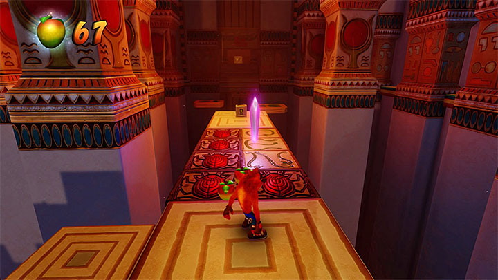Both paths (the left one which becomes available after you use the violet gem and main one to the right) converge in the spot shown in the above screenshot, where you also have to eliminate a cobra - Crash Bandicoot N. Sane Trilogy: Tomb Time - Crash Bandicoot N. Sane Trilogy: Crash Bandicoot 3 - Arabic location - Crash Bandicoot N. Sane Trilogy Game Guide