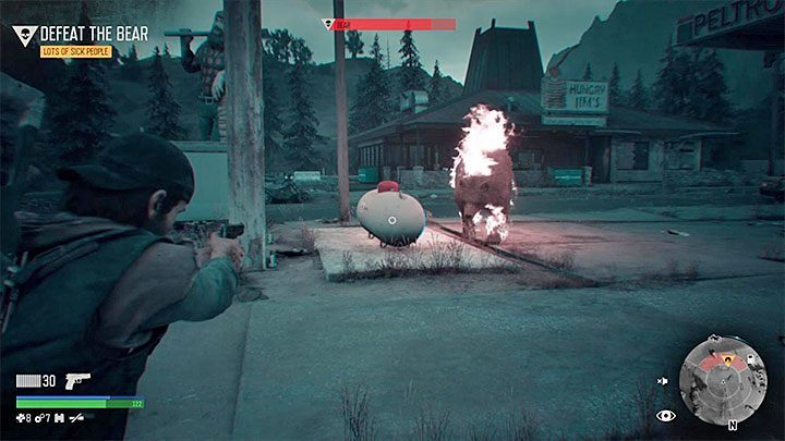 Even better way to weaken the enemy is to stand near the big white container shown in the image - Days Gone: - How to kil Bear boss in Lots of Sick People? - Combat - Days Gone Guide