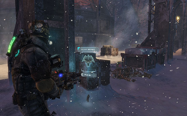 Behind one of the pillars, right next to the crates, to the right in front of the facilitys entrance - Chapter 10 | Secrets - Secrets - Dead Space 3 Game Guide