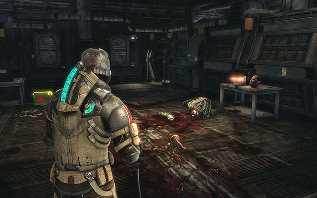 On the table with a head, in the passage between pistons - Chapter 14 - p. 1 | Secrets - Secrets - Dead Space 3 Game Guide