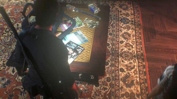 Hoffmans files on the table. - Chapter 13 - Stronghold | Walkthrough - Walkthrough - The Evil Within 2 Game Guide