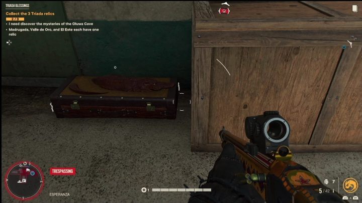 The weapon crate is located behind the warehouse, right next to the water - Far Cry 6: Best weapons - list - Basics - Far Cry 6 Guide