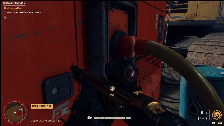 Exit the cave and track down the red object covered with wooden pallets - Far Cry 6: Mimo Abosis Triada Relic - Treasure Hunts - El Este - Far Cry 6 Guide