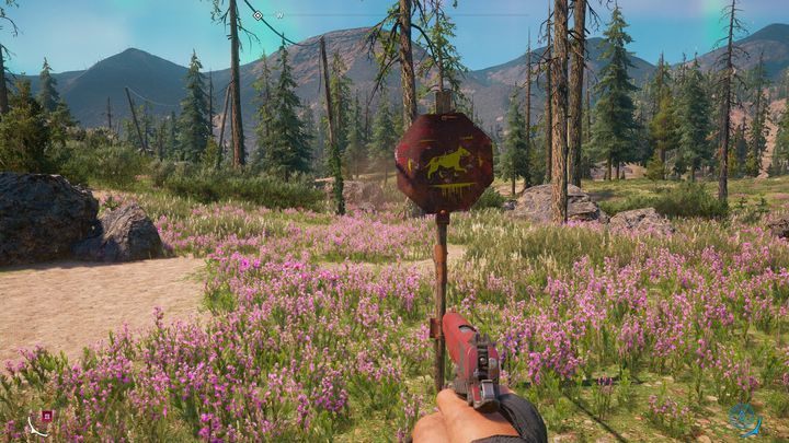 A road sign informing you that this area is inhabited by wild dogs. - Hunting | Side activities in Far Cry New Dawn - Side activities - Far Cry New Dawn Guide