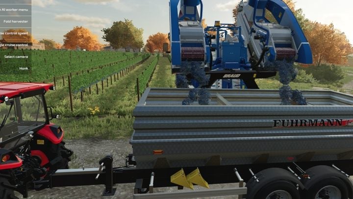 The harvesters are emptied by placing a trailer behind the harvester - Farming Simulator 22: Fruit-growing - Farming Simulator 22: Orchards & greenhouses - Farming Simulator 22 Guide