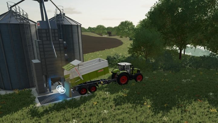 To empty a trailer into a silo, simply stand on the trailer marker and start unloading - Farming Simulator 22: Storing harvests - Farming Simulator 22: Field work - Farming Simulator 22 Guide