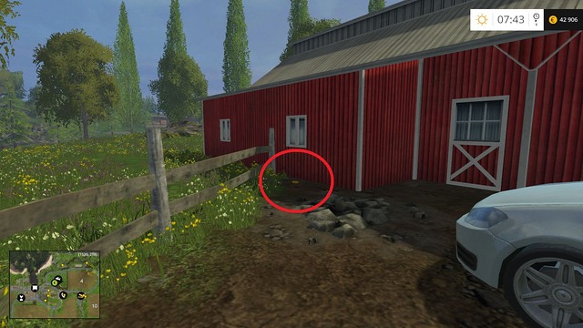 Near the wooden fence, behind the car - Section B - coins 13 - 29 - Gold Coins - Farming Simulator 15 Game Guide