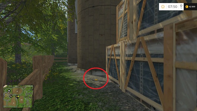 Behind the silos and some wooden crates - Section B - coins 13 - 29 - Gold Coins - Farming Simulator 15 Game Guide