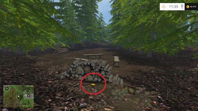 Behind a stack of wood - Section E - coins 55 - 69 - Gold Coins - Farming Simulator 15 Game Guide