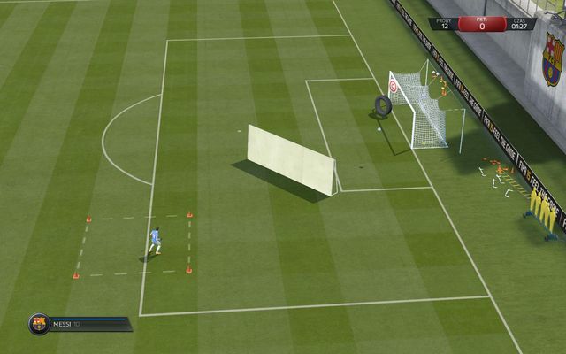 You need to use a chip shot, to lob the ball over a wall and hit one of the targets inside the goal - Advanced shooting - Skill games and practice - FIFA 15 - Game Guide and Walkthrough