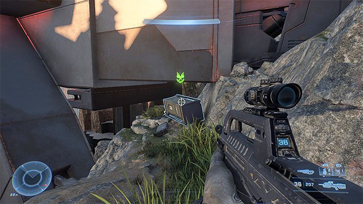 Examine the area under the landing pad (by going from the left side) to find a locker with a cosmetic item on the rocks - Halo Infinite: The Tower (Lockdown) - list, skulls, audio logs - Lock - Halo Infinite Guide