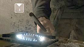 The rod that can be used for burning the wound is lying next to the table - Chapters: Paparazzi - The Lizard | Heavy Rain Achievements - Achievements / Trophies - Heavy Rain HD Guide