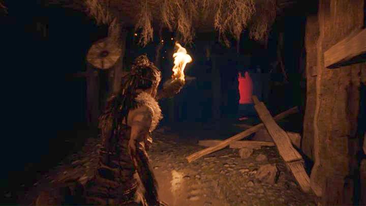 Follow the voice to find a tunnel lit by a red light - Hellblade Senuas Sacrifice: Third shard - The Story of Tyrfing - Forging Gramr - Hellblade: Senuas Sacrifice Game Guide