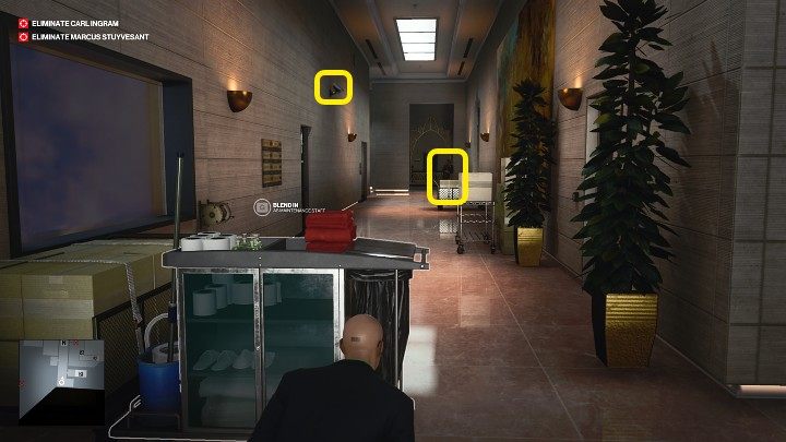 The corridor is guarded by one guard and a camera mounted on the wall to the left - Hitman 3: How The Mighty Fall - Dubai, Mission Stories, walkthrough - On Top of the World - Dubai - Hitman 3 Guide