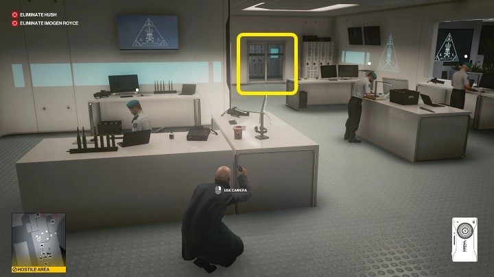 Hide behind the desk of one of the guards - Hitman 3: CCTV in Chongqing (China) - where it is stored? - End Of An Era - Chongqing - Hitman 3 Guide