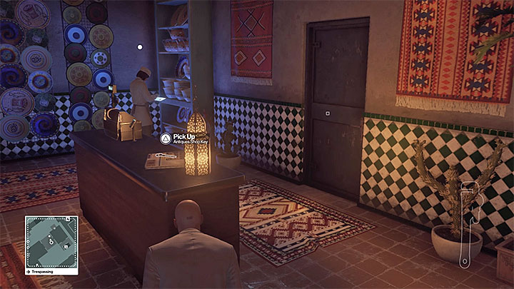 Sneak into the shop and open the door, using the key on the counter - Studying Mendolas route and reaching the VIP area | Marrakesh: A House Built on Sand - Summer Episode - Marrakesh: A House Built on Sand - Hitman Game Guide