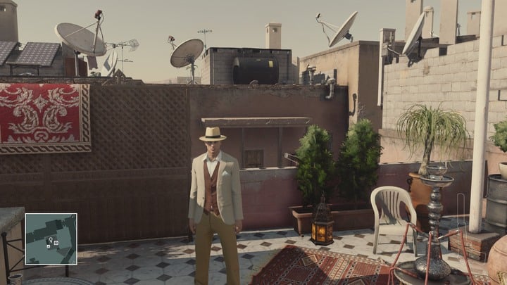 The headmaster is working on his new novel on the rooftop of the carpet shop. - Disguises | Marrakesh - Marrakesh: A Gilded Cage - Hitman Game Guide