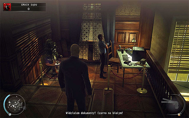A computer terminal to interact with is located left from the entrance to the balcony - Courthouse - Getting to the holding cells in defendant disguise | 15: Skurkys Law - 15: Skurkys Law - Hitman: Absolution Game Guide