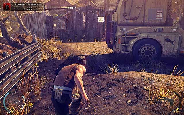 Carefully walk past machinery, which should be occupied by a single guard and a single truck driver - Factory Compound - Getting inside the factory building | 11: Dexter Industries - 11: Dexter Industries - Hitman: Absolution Game Guide