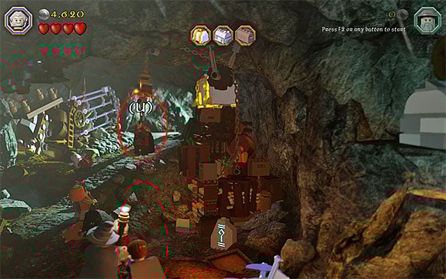 Start exploring the troll cave, where there are three chests with elven swords hidden (initially, you can play as any of the characters) - Stage 5 (The Troll Hoard): Explore the cave | Walkthrough | LEGO The Hobbit - Walkthrough - LEGO The Hobbit Game Guide & Walkthrough