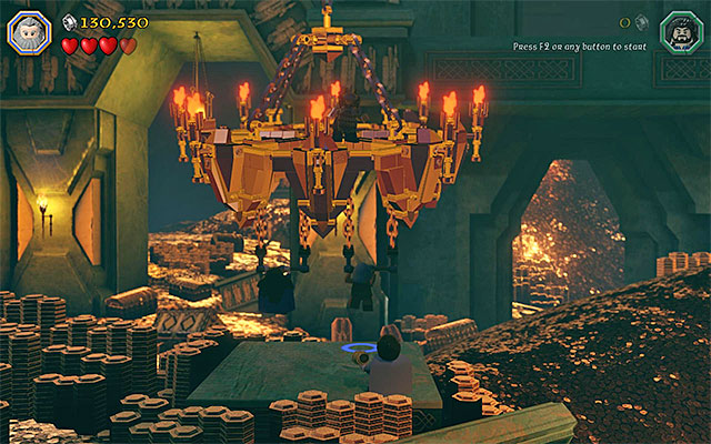 Jump towards the handles, thanks to which the chandelier will break loose - Stage 1 (Greatest Kingdom in Middle-Earth): Smaugs attack | Walkthrough - Walkthrough - LEGO The Hobbit Game Guide & Walkthrough