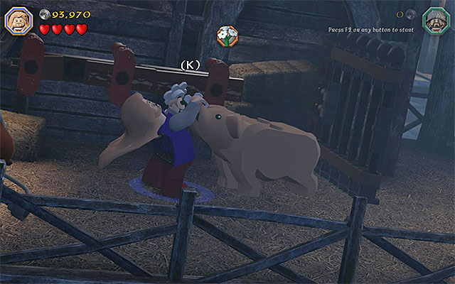 You need to complete a minigame to retrieve the medicine from the swine - Stage 12 (A Warm Welcome): The docks | Walkthrough | LEGO The Hobbit - Walkthrough - LEGO The Hobbit Game Guide & Walkthrough
