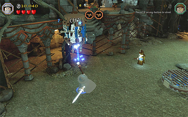 If you have performed the most recent action correctly, the stream of light will be sent towards the nearby target, thanks to which the passage at the stairs will unlock - Stage 14 (The Necromancer): The keeps exterior | Walkthrough - Walkthrough - LEGO The Hobbit Game Guide & Walkthrough