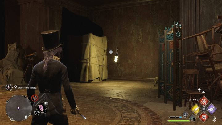 There is a lantern next to the wardrobe wrapped in a sheet - Hogwarts Legacy: Minding Your Own Business - Hogwarts Legacy: Hogsmeade Side Quests - Hogwarts Legacy Guide