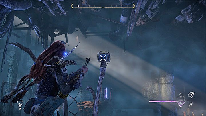 Climb up to the higher balcony and grab the metal object pictured above with your Pullcaster - Horizon Forbidden West: Deaths Door - walkthrough - Main Storyline - Horizon Forbidden West Guide