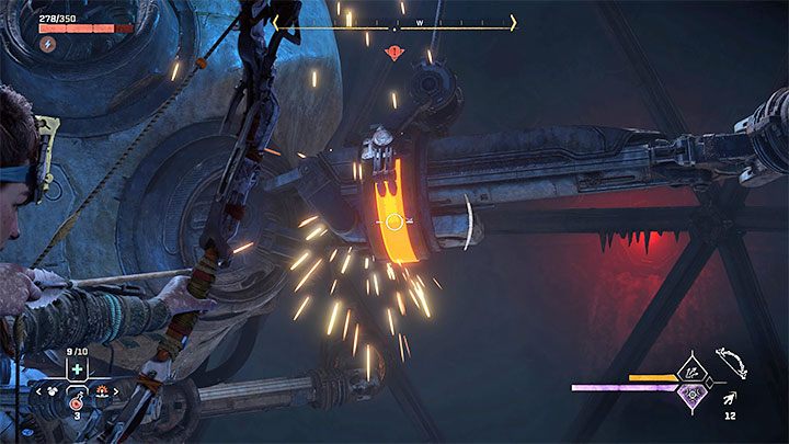 You must shoot the red hooks of the large device, as pictured above - Horizon Forbidden West: Deaths Door - walkthrough - Main Storyline - Horizon Forbidden West Guide