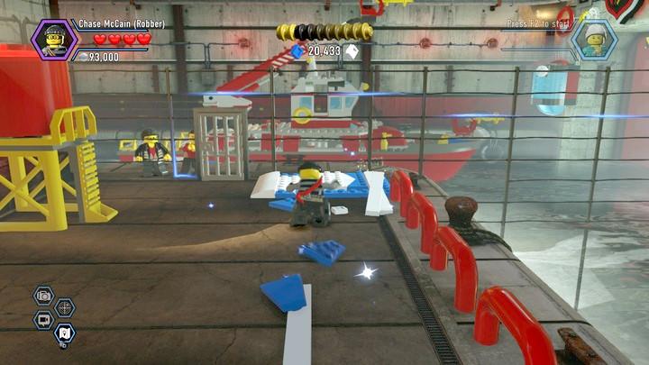 Use the catapult to make it over the water and disable the door blockade. - Fireman training | Walkthrough - Chapter 10 - LEGO City: Undercover Game Guide