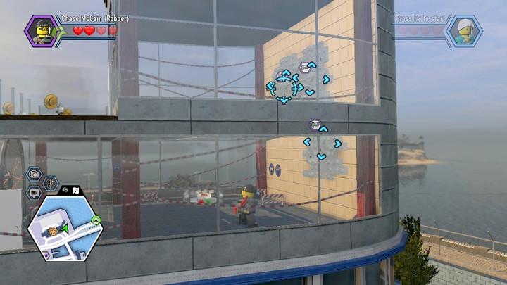Again, to use the climbing wall, you have to color the white blocks on the wall - Hospital | Walkthrough - Chapter 10 - LEGO City: Undercover Game Guide